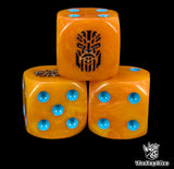 Close up of an orange 16mm resin D6 die engraved with a black rune and a stern face and blue pips
