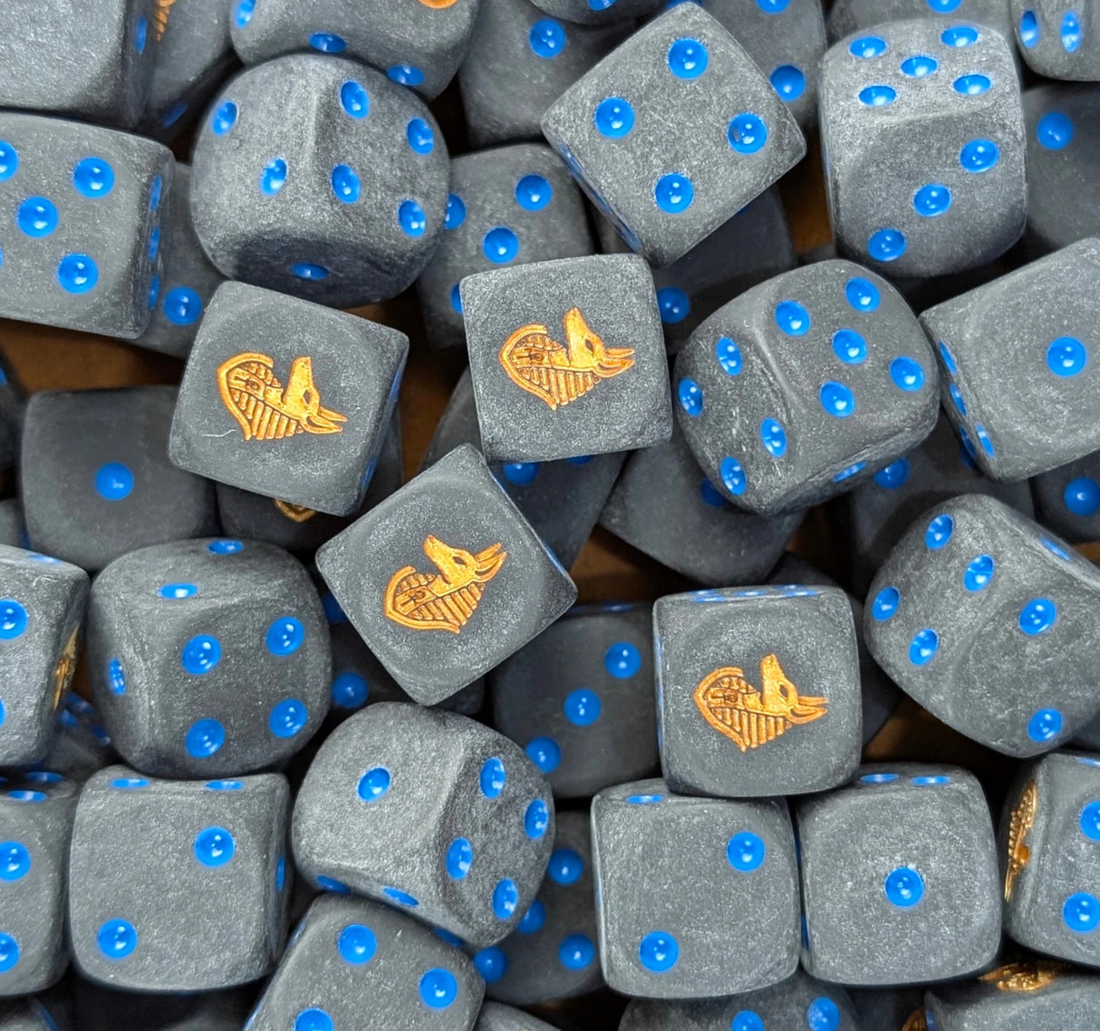 Pile of black anubis jackal 16mm D6 dice for fantasy RPG and DnD games