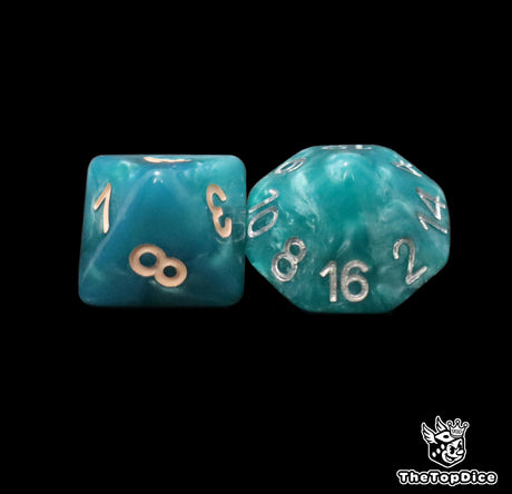 Close up of a blue D8 and D16 with beige numbers for scatter and long range rolls
