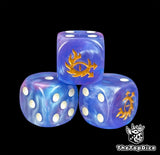 Close up of a blue 16mm resin D6 die engraved with a gold eye trailing flames and chaos spikes