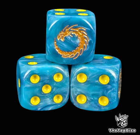 Close up of a blue 16mm resin D6 die engraved with a gold dragon coiled in a loop and yellow pips