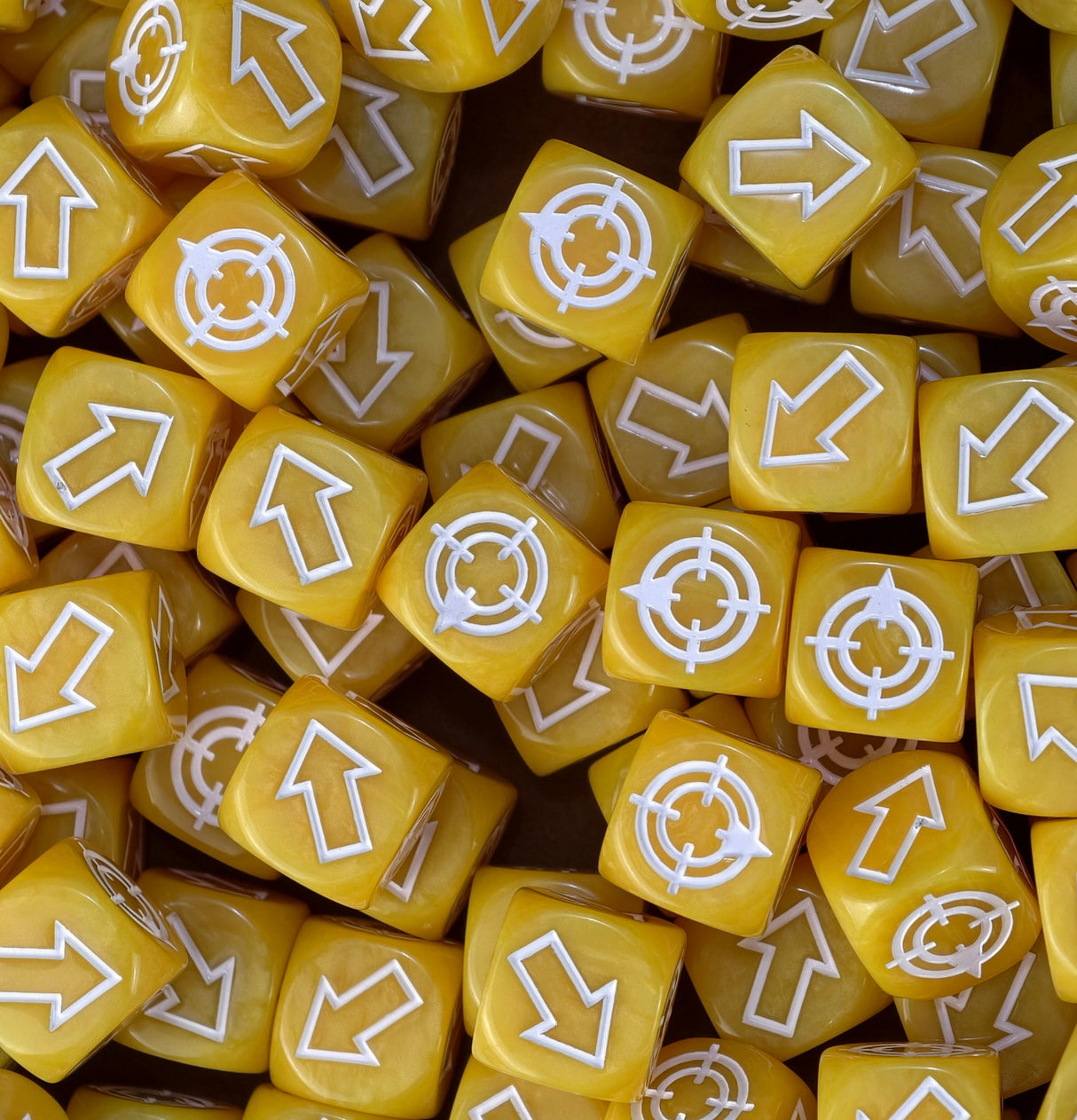 Banana yellow scatter dice piled in a tray, spotted from the far end of a six foot table
