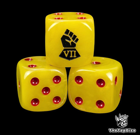 Close-up of three yellow 16mm grimdark D6 dice engraved with a black fist emblem