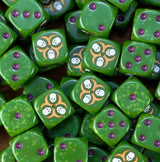 A pile of rotten green Nurgle D6 with purple pips and gold hazards
