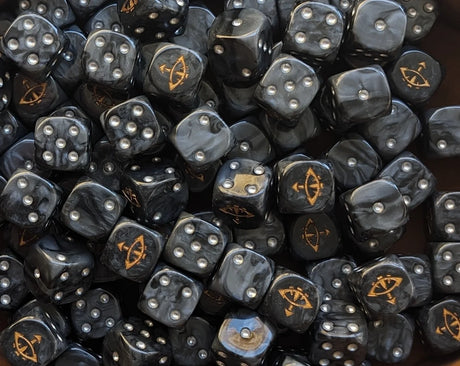 Pile of black and grey eye 16mm D6 dice for a sci-fi traitor army
