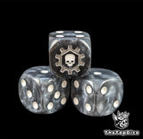 Close up of a black 16mm resin D6 die engraved with a white skull in a silver gear and white pips