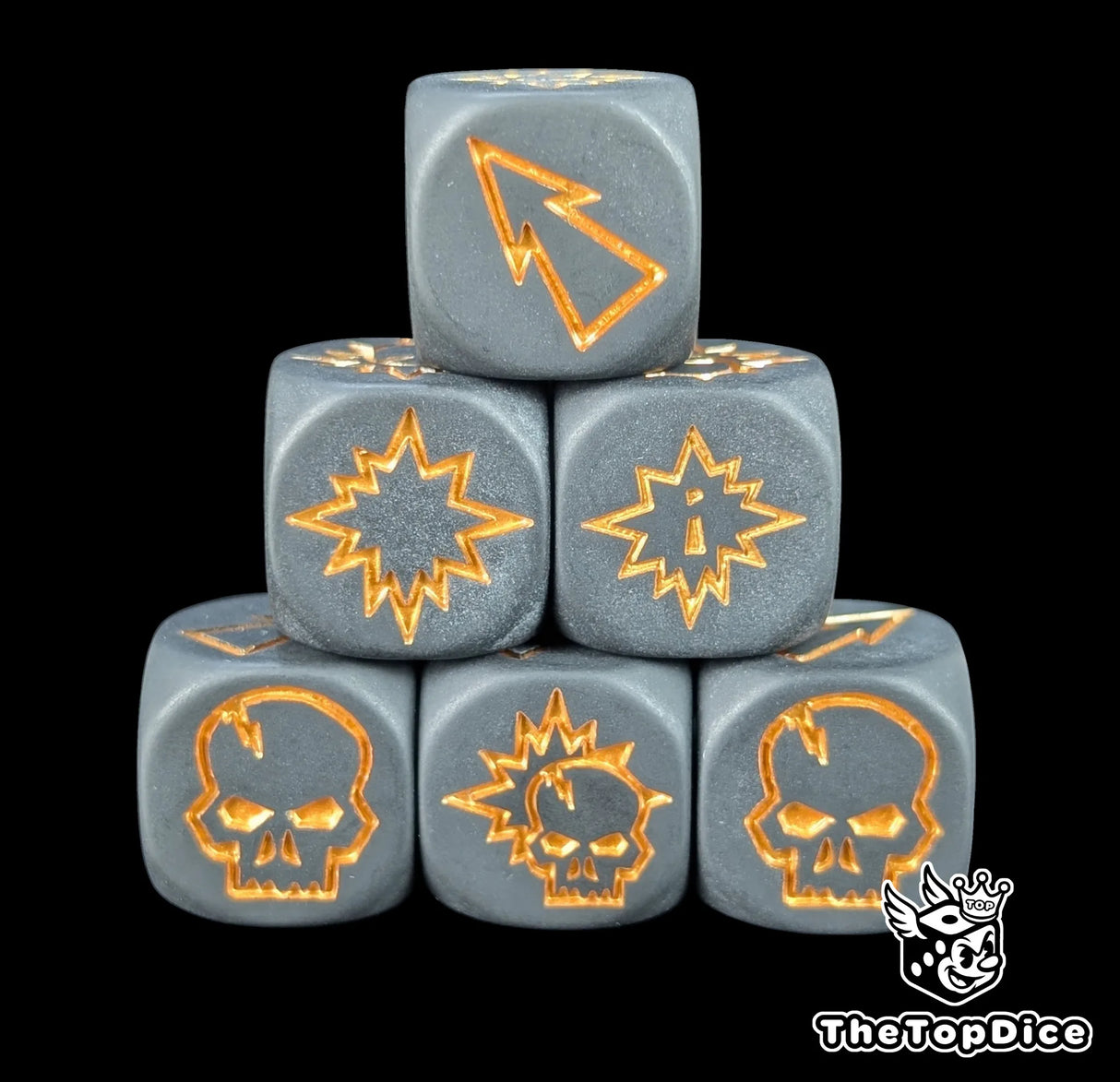 Close up of three black 16mm block dice with gold symbols for resolving blocks in fantasy football