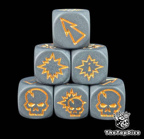 Close up of three black 16mm block dice with gold symbols for resolving blocks in fantasy football