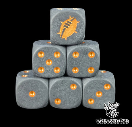 Close up of two matte black D6 with a gold custom logo on the six face for fantasy football games