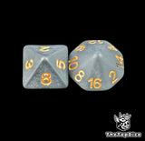Close up of a black D8 and D16 with gold numbers for scatter and long range fantasy football rolls