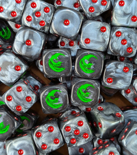 Pile of black grin moon 16mm D6 dice for a fantasy goblin horde