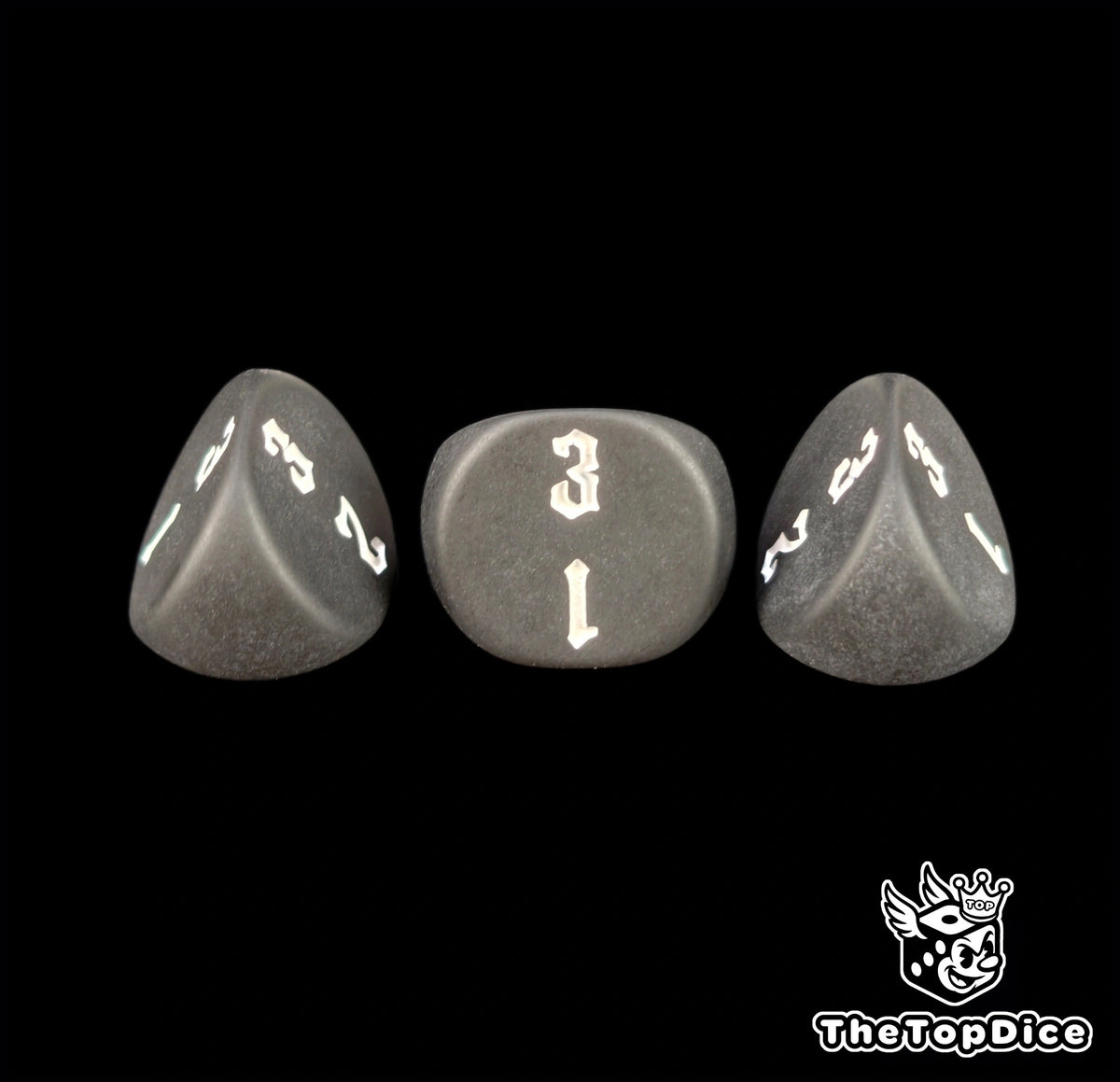 Sharp engraving on matte black 16mm three sided dice, seen close