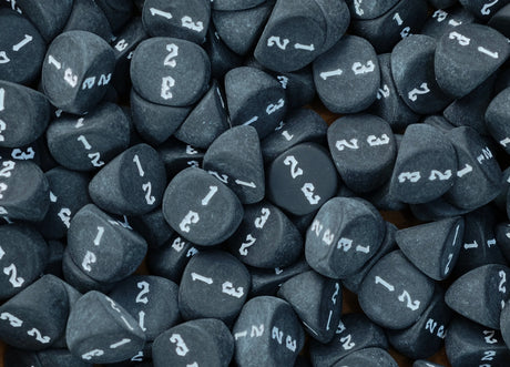 Black D3 dice loaded into a tray with the white numbering face up