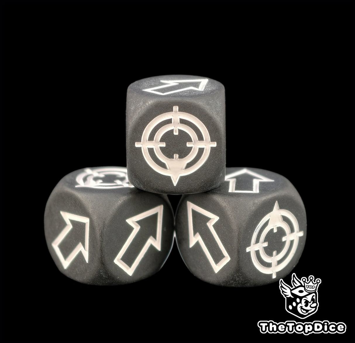 The flat finish killing glare on a matte black scatter die, three of them in frame