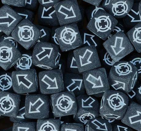 Matte black and white scatter dice filling a tray for cannons and catapults