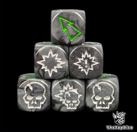 Close up of three black and grey orc 16mm block dice with green pips for resolving blocks