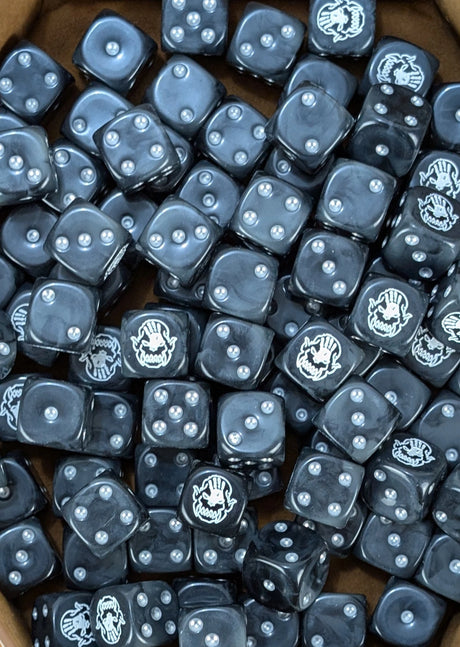 Pile of black orc hand 16mm D6 dice for an orc fantasy miniature horde