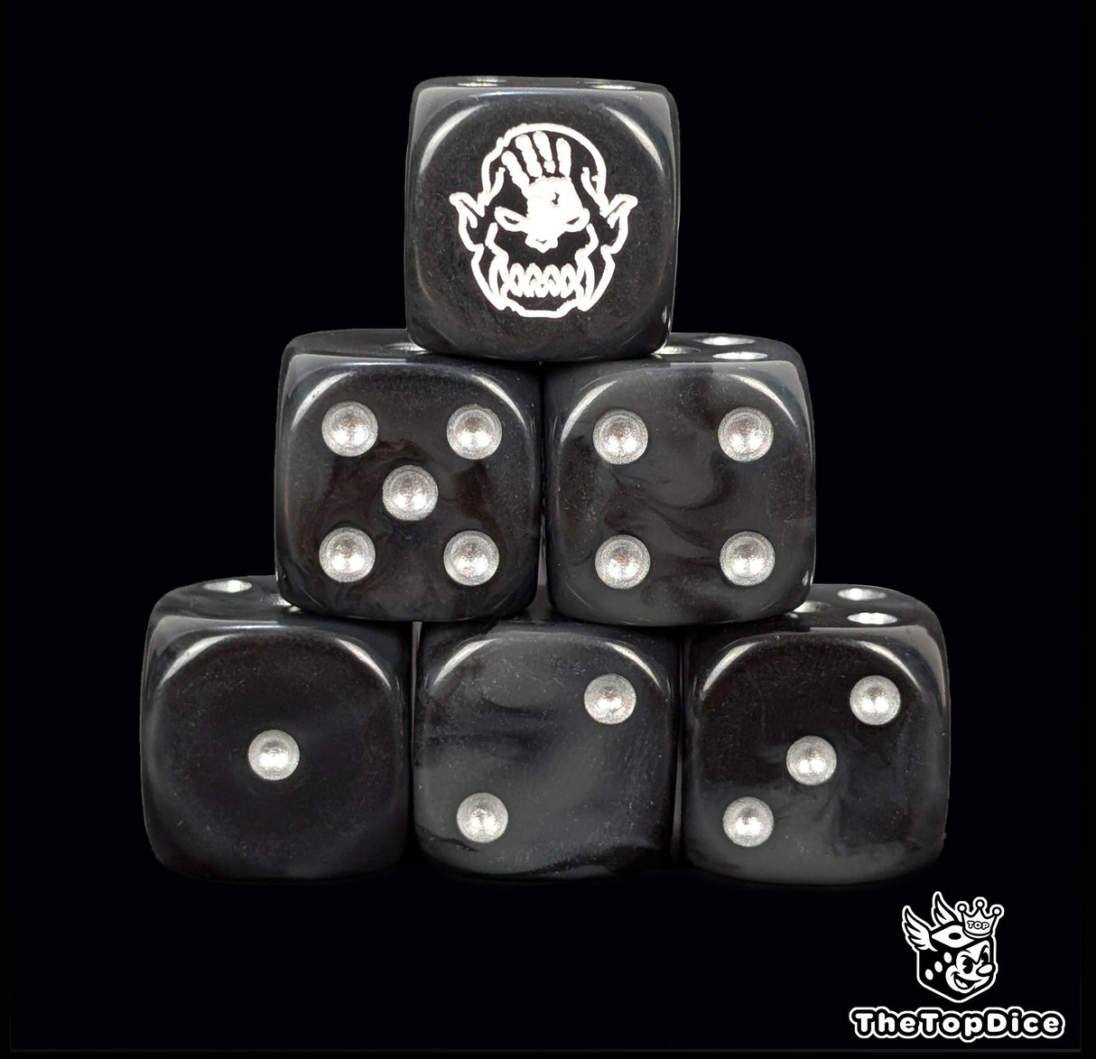 Black 16mm D6 dice with a white hand orc face emblem and silver pips for epic fantasy wargames