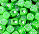 A pile of green Kroot dice with silver pips and black quilled heads