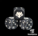 Close up of a black and grey 16mm resin D6 die engraved with a white raven and silver pips