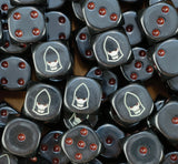 A pile of black Dark Reapers dice with red pips and pale white helms