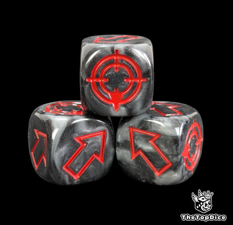 Close up of a black and grey resin scatter die showing the red direction arrows
