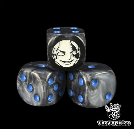 Close up of a black 16mm resin D6 die engraved with a white fighter emblem and blue pips