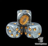 Close up of a black semi clear 16mm resin D6 die engraved with a gold ring and gold pips