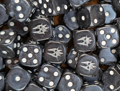 Pile of black shadow wraith 16mm D6 dice for a dark fantasy miniature army