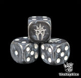 Close up of a black 16mm resin D6 die engraved with a silver wraith helm and white pips