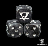 Close up of a black 16mm resin D6 die engraved with a triangle skull biting a white knife