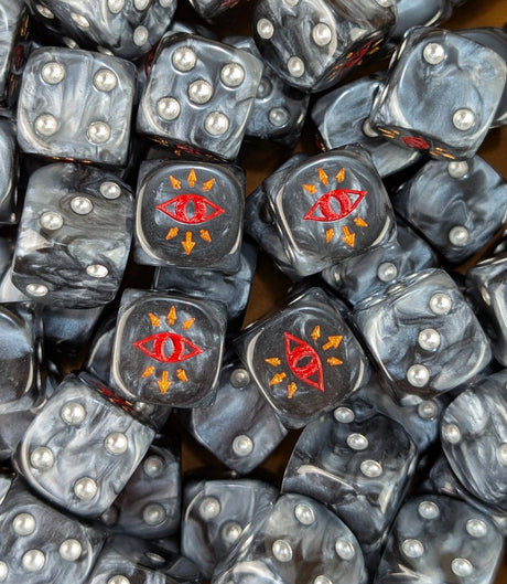 Pile of black traitor eye 16mm D6 dice for a sci-fi chaos army