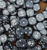 Pile of black and grey white tree 16mm D6 dice for a noble fantasy miniature army