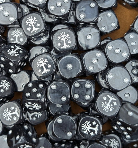 Pile of black and grey white tree 16mm D6 dice for a noble fantasy miniature army