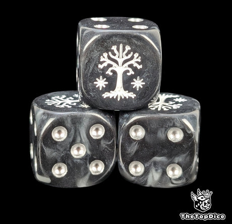Close up of a black and grey 16mm resin D6 die engraved with a white tree and silver pips