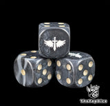 Close up of a black and grey 16mm resin D6 die engraved with a white winged sword and beige pips
