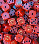 Pile of red 16mm D6 dice with gold maw emblems for a sci-fi berserker army