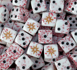 A pile of blood speckled white chaos D6 with gold eight pointed stars