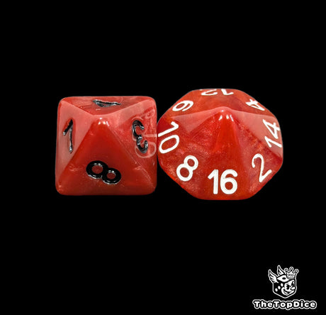 Close up of a blood red D8 and D16 with black numbers for scatter and long range rolls