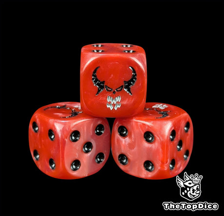 Close-up of a red D6 die with a horned daemon face and white fangs