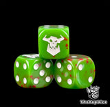 Three green greenskin Ork dice spattered with red and a white orc skull