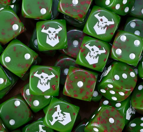 A pile of blood spattered green orc D6 with white pips and Ork skulls