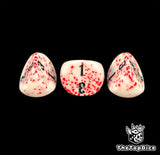 Three bloodspatter 16mm D3 dice in close up, numbers inked in black