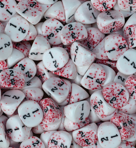 Bloodspatter three sided dice packed across a tray as wound markers