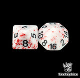 Close up of a white blood spattered D8 and D16 with black numbers for scatter and long range rolls