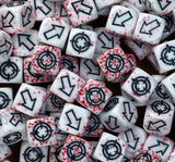 Bloodspatter dice heaped together, red speckling running right through the white resin
