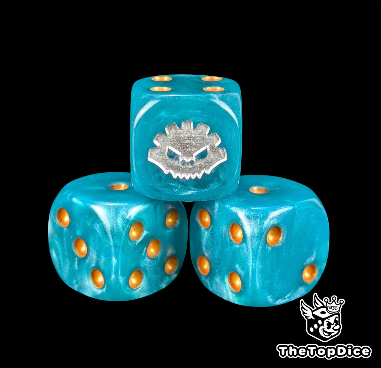 Close up of a blue 16mm resin D6 die engraved with a silver aztec rune and gold pips