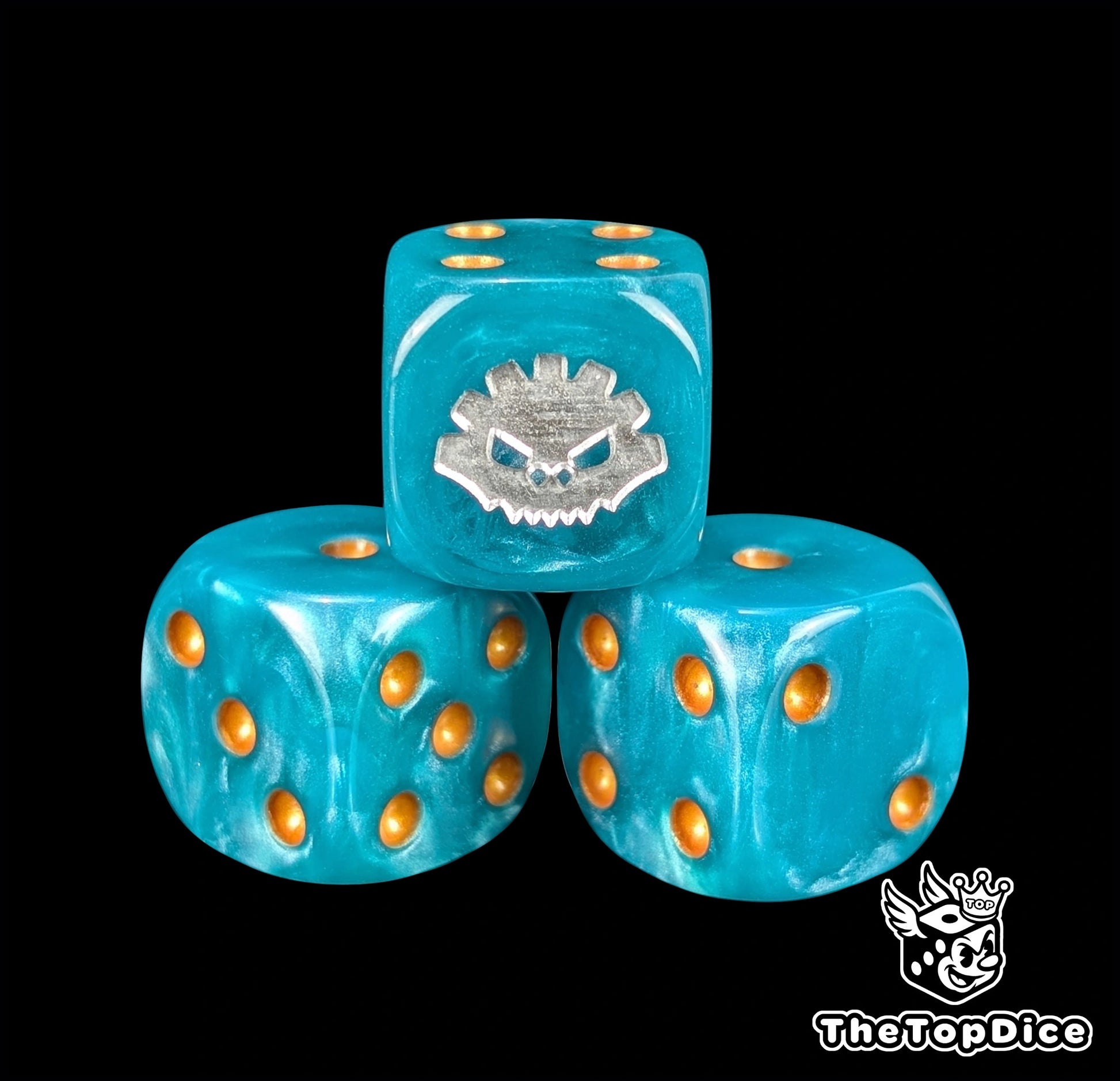 Close up of a blue 16mm resin D6 die engraved with a silver aztec rune and gold pips