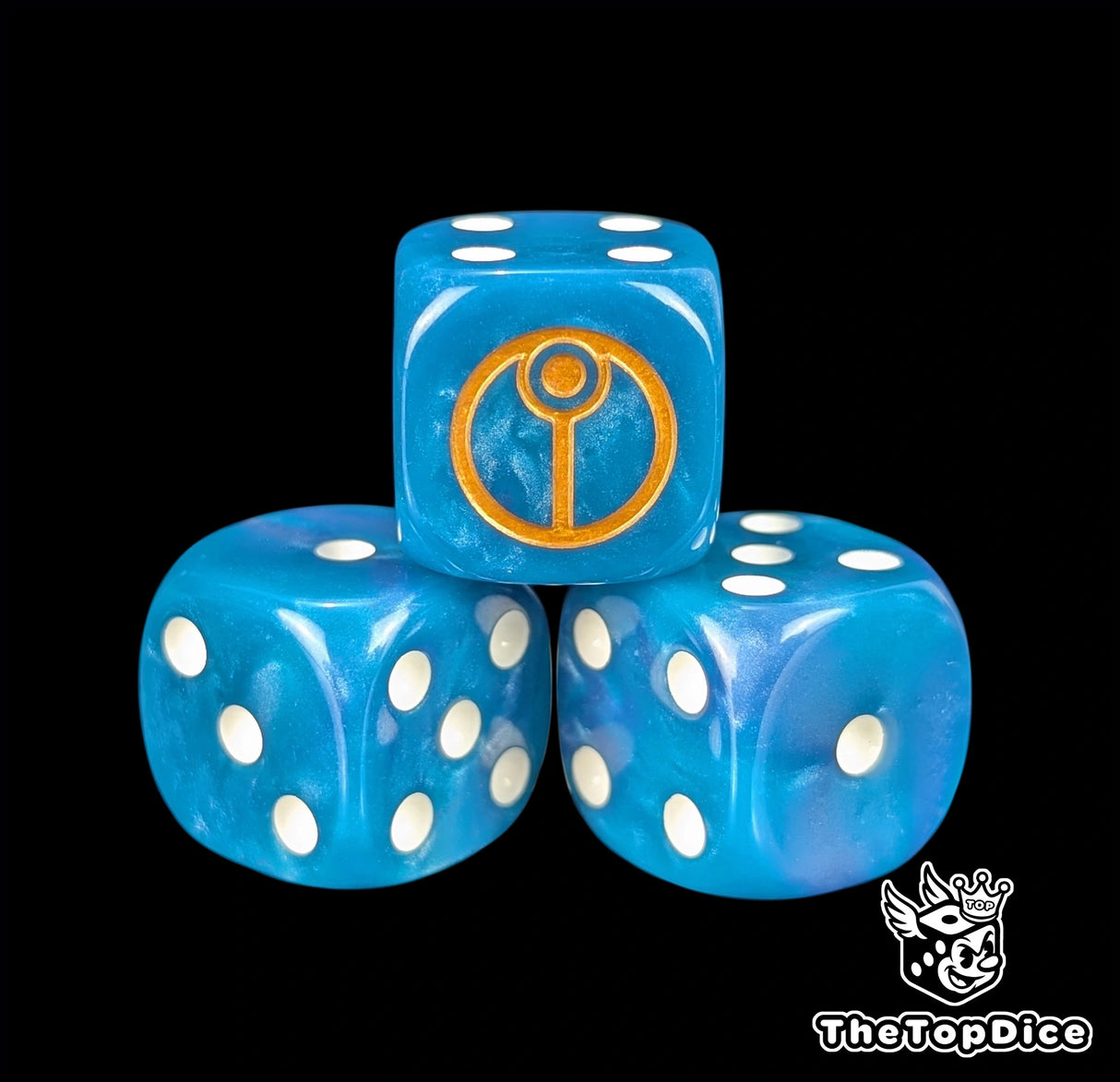 Close up of a blue 16mm resin D6 die engraved with a gold circular cadre sigil and white pips