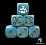 Close up of two blue D6 with a white triple mountain logo on the six face for fantasy football